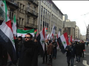 Ahwazi and Syrian freedom flags march together to demand the EU address their human rights. 